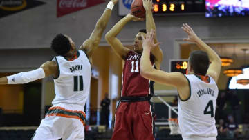 Nov 24, 2016; Kissimmee, FL, USA; Stanford Cardinal guard Dorian Pickens (11) shots the ball over Miami Hurricanes guard Bruce Brown (11) during the first half at HP Field House. Mandatory Credit: Jasen Vinlove-USA TODAY Sports