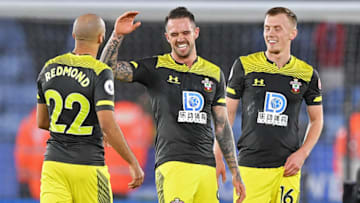 Southampton's English striker Danny Ings (C) celebrates with Southampton's English midfielder Nathan Redmond (L) and Southampton's English midfielder James Ward-Prowse (R) on the pitch after the English Premier League football match between Leicester City and Southampton at King Power Stadium in Leicester, central England on January 11, 2020. - Southampton won the game 2-1. (Photo by Justin TALLIS / AFP) / RESTRICTED TO EDITORIAL USE. No use with unauthorized audio, video, data, fixture lists, club/league logos or 'live' services. Online in-match use limited to 120 images. An additional 40 images may be used in extra time. No video emulation. Social media in-match use limited to 120 images. An additional 40 images may be used in extra time. No use in betting publications, games or single club/league/player publications. / (Photo by JUSTIN TALLIS/AFP via Getty Images)