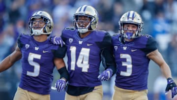 SEATTLE, WA - OCTOBER 28: Defensive back Myles Bryant #5 of the Washington Huskies celebrates with defensive back Jojo McIntosh #14 and defensive back Elijah Molden #3 after recovering a fumble against the UCLA Bruins at Husky Stadium on October 28, 2017 in Seattle, Washington. (Photo by Otto Greule Jr/Getty Images)