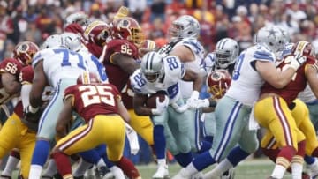 Dec 28, 2014; Landover, MD, USA; Dallas Cowboys running back DeMarco Murray (29) carries the ball as Washington Redskins free safety Ryan Clark (25) defends in the first quarter at FedEx Field. Mandatory Credit: Geoff Burke-USA TODAY Sports