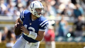 Sep 21, 2014; Jacksonville, FL, USA; Indianapolis Colts quarterback Andrew Luck (12) rolls out to pass against the Jacksonville Jaguars during the first quarter at EverBank Field. Mandatory Credit: John David Mercer-USA TODAY Sports