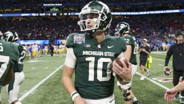 Dec 30, 2021; Atlanta, GA, USA; Michigan State Spartans quarterback Payton Thorne (10) celebrates after a victory against the Pittsburgh Panthers in the second half during the 2021 Peach Bowl at Mercedes-Benz Stadium. Mandatory Credit: Brett Davis-USA TODAY Sports