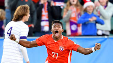 Dec 12, 2021; Cary, NC, USA; Clemson forward Isaiah Reid (27) reacts at the end of the game as Washington defender Ryan Sailor (4) is in the background at WakeMed Soccer Park. Clemson defeated Washington 2-0. Mandatory Credit: Bob Donnan-USA TODAY Sports