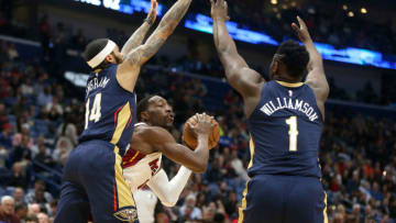 Mar 6, 2020; New Orleans, Louisiana, USA; Miami Heat forward Bam Adebayo (13) controls the ball against New Orleans Pelicans forwards Brandon Ingram (14) and Zion Williamson ( Chuck Cook-USA TODAY Sports