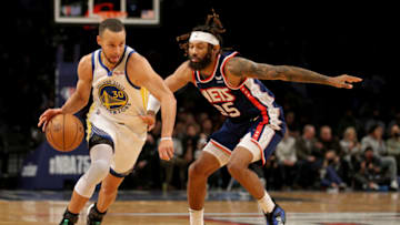 Nov 16, 2021; Brooklyn, New York, USA; Golden State Warriors guard Stephen Curry (30) drives around Brooklyn Nets guard DeAndre' Bembry (95) during the first quarter at Barclays Center. Mandatory Credit: Brad Penner-USA TODAY Sports