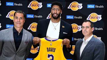 EL SEGUNDO, CA - JULY 13: Anthony Davis (C) is introduced as the newest player of the Los Angeles Lakers during a press conference with general manager Rob Pelinka (L) and head coach Frank Vogel (R) at UCLA Health Training Center on July 13, 2019 in El Segundo, California. NOTE TO USER: User expressly acknowledges and agrees that, by downloading and/or using this Photograph, user is consenting to the terms and conditions of the Getty Images License Agreement. (Photo by Kevork Djansezian/Getty Images)