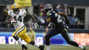January 18, 2015; Seattle, WA, USA; Green Bay Packers running back James Starks (44) runs the ball ahead of Seattle Seahawks cornerback Richard Sherman (25) during the second half in the NFC Championship game at CenturyLink Field. Mandatory Credit: Kyle Terada-USA TODAY Sports