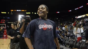 Sep 19, 2013; Atlanta, GA, USA; Washington Mystics guard Ivory Latta (12) celebrates a victory against the Atlanta Dream at Philips Arena. The Mystics defeated the Dream 71-56. Mandatory Credit: Brett Davis-USA TODAY Sports