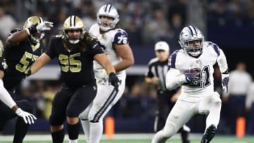 ARLINGTON, TEXAS - NOVEMBER 29: Ezekiel Elliott #21 of the Dallas Cowboys runs for a first down in the fourth quarter against the New Orleans Saints at AT&T Stadium on November 29, 2018 in Arlington, Texas. (Photo by Ronald Martinez/Getty Images)
