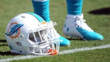 Oct 26, 2014; Jacksonville, FL, USA; A Miami Dolphins helmet rest on the field prior to the game against the Jacksonville Jaguars at EverBank Field. Mandatory Credit: Melina Vastola-USA TODAY Sports