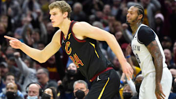 Nov 22, 2021; Cleveland, Ohio, USA; Cleveland Cavaliers forward Lauri Markkanen (24) celebrates his three point basket beside Brooklyn Nets forward James Johnson (16) in the fourth quarter at Rocket Mortgage FieldHouse. Mandatory Credit: David Richard-USA TODAY Sports