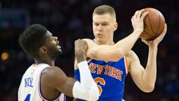 Dec 18, 2015; Philadelphia, PA, USA; New York Knicks forward Kristaps Porzingis (6) looks for a opening past the defense of Philadelphia 76ers forward Nerlens Noel (4) during the first quarter at Wells Fargo Center. Mandatory Credit: Bill Streicher-USA TODAY Sports