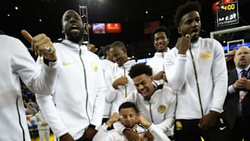 OAKLAND, CA - OCTOBER 16: Stephen Curry #30 and the Golden State Warriors celebrate after receiving their 2017-2018 Championship rings prior to their game against the Oklahoma City Thunder at ORACLE Arena on October 16, 2018 in Oakland, California. NOTE TO USER: User expressly acknowledges and agrees that, by downloading and or using this photograph, User is consenting to the terms and conditions of the Getty Images License Agreement. (Photo by Ezra Shaw/Getty Images)