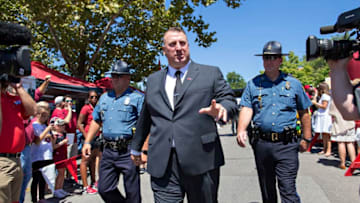 FAYETTEVILLE, AR - SEPTEMBER 3: Head Coach Bret Bielema of the Arkansas Razorbacks greets fans during the walk into the stadium before a game against the Louisiana Tech Bulldogs at Razorback Stadium on September 3, 2016 in Fayetteville, Arkansas. (Photo by Wesley Hitt/Getty Images)