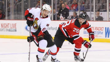 Jan 21, 2016; Newark, NJ, USA; Ottawa Senators left wing Mike Hoffman (68) skates with the puck defended by New Jersey Devils defenseman Damon Severson (28) during the first period at Prudential Center. Mandatory Credit: Ed Mulholland-USA TODAY Sports