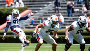 Auburn football punter Oscar Chapman (91) punts the ball during warm ups during the A-Day spring practice at Jordan-Hare Stadium in Auburn, Ala., on Saturday, April 9, 2022.