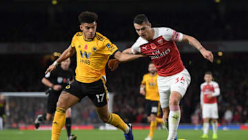 LONDON, ENGLAND - NOVEMBER 11: Granit Xhaka of Arsenal battles for possession with Morgan Gibbs-White of Wolverhampton Wanderers during the Premier League match between Arsenal FC and Wolverhampton Wanderers at Emirates Stadium on November 11, 2018 in London, United Kingdom. (Photo by Shaun Botterill/Getty Images)