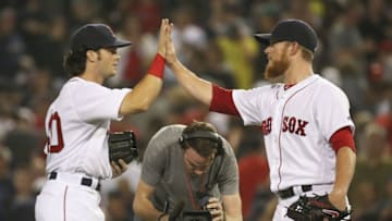 Aug 13, 2016; Boston, MA, USA; Boston Red Sox left fielder Andrew Benintendi (left) and relief pitcher Craig Kimbrel (right) celebrate a victory against the Arizona Diamondbacks at Fenway Park. Mandatory Credit: Mark L. Baer-USA TODAY Sports