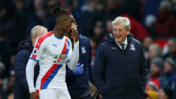 MANCHESTER, ENGLAND - NOVEMBER 24: Wilfried Zaha of Crystal Palace speaks with Roy Hodgson, Manager of Crystal Palace following their sides draw in the Premier League match between Manchester United and Crystal Palace at Old Trafford on November 24, 2018 in Manchester, United Kingdom. (Photo by Alex Livesey/Getty Images)