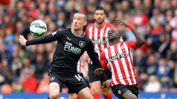 SOUTHAMPTON, ENGLAND - MARCH 21: Sadio Mane of Southampton challenges David Jones of Burnley during the Barclays Premier League match between Southampton and Burnley at St Mary's Stadium on March 21, 2015 in Southampton, England. (Photo by Tony Marshall/Getty Images)