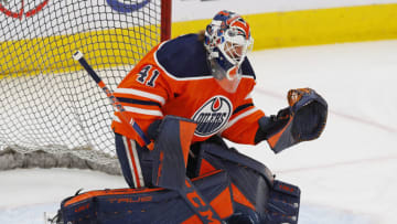 Apr 16, 2022; Edmonton, Alberta, CAN; Edmonton Oilers goaltender Mike Smith (41) makes a save during warmup against the Vegas Golden Knights at Rogers Place. Mandatory Credit: Perry Nelson-USA TODAY Sports