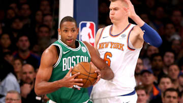 NEW YORK, NY - DECEMBER 21: Terry Rozier #12 of the Boston Celtics works against Kristaps Porzingis #6 of the New York Knicks in the second quarter during their game at Madison Square Garden on December 21, 2017 in New York City. NOTE TO USER: User expressly acknowledges and agrees that, by downloading and or using this photograph, User is consenting to the terms and conditions of the Getty Images License Agreement. (Photo by Abbie Parr/Getty Images)