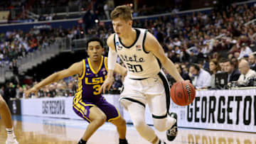 WASHINGTON, DC - MARCH 29: Matt McQuaid #20 of the Michigan State Spartans drives to the basket against Tremont Waters #3 of the LSU Tigers during the first half in the East Regional game of the 2019 NCAA Men's Basketball Tournament at Capital One Arena on March 29, 2019 in Washington, DC. (Photo by Patrick Smith/Getty Images)