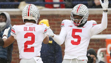ANN ARBOR, MICHIGAN - NOVEMBER 27: Garrett Wilson #5 of the Ohio State Buckeyes celebrates his touchdown against the Michigan Wolverines with teammate Chris Olave #2 during the second quarter at Michigan Stadium on November 27, 2021 in Ann Arbor, Michigan. (Photo by Mike Mulholland/Getty Images)