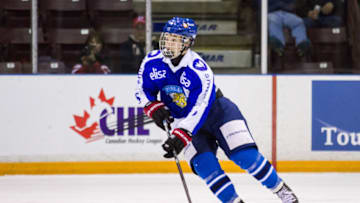 SARNIA, ON - NOVEMBER 02: Tarmo Reunanen #8 of Finland moves the puck against Canada White during the World Under-17 Hockey Challenge on November 2, 2014 at the RBC Centre in Sarnia, Ontario. (Photo by Dennis Pajot/Getty Images)