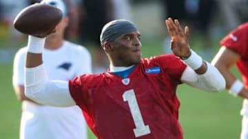 Jul 26, 2014; Spartanburg, SC, USA; Carolina Panthers quarterback Cam Newton (1) passes during training camp at Gibbs Stadium. Mandatory Credit: Jim Dedmon-USA TODAY Sports