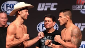 Aug 27, 2013; Indianapolis, IN, USA; Donald Cerrone (left) and Rafael dos Anjos during weigh-ins for the upcoming UFC Fight Night 27 at Bankers Life Fieldhouse. Mandatory Credit: Pat Lovell-USA TODAY Sports