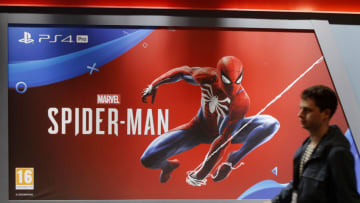 PARIS, FRANCE - OCTOBER 25: A visitor walks past an adversiting for the Video game Marvel's Spider-Man developed by Insomniac Games and published by par Sony Interactive Entertainment during the 'Paris Games Week' on October 25, 2018 in Paris, France. 'Paris Games Week' is an international trade fair for video games and runs from October 26 to 31, 2018. (Photo by Chesnot/Getty Images)
