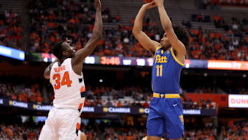 SYRACUSE, NEW YORK - JANUARY 25: Bourama Sidibe #34 of the Syracuse Orange guards Justin Champagnie #11 of the Pittsburgh Panthers during the first half of an NCAA basketball game at the Carrier Dome on January 25, 2020 in Syracuse, New York. (Photo by Bryan Bennett/Getty Images)