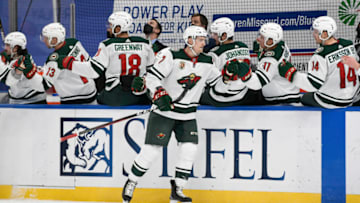 Apr 10, 2021; St. Louis, Missouri, USA; Minnesota Wild center Nico Sturm (7) is congratulated by teammates after scoring a goal against the St. Louis Blues in the first period at Enterprise Center. Mandatory Credit: Jeff Le-USA TODAY Sports