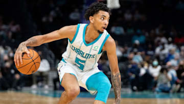 CHARLOTTE, NORTH CAROLINA - OCTOBER 13: James Bouknight #5 of the Charlotte Hornets brings the ball up court against the Dallas Mavericks during their game at Spectrum Center on October 13, 2021 in Charlotte, North Carolina. NOTE TO USER: User expressly acknowledges and agrees that, by downloading and or using this photograph, User is consenting to the terms and conditions of the Getty Images License Agreement. (Photo by Jacob Kupferman/Getty Images)