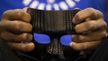 PHILADELPHIA, PA - APRIL 14: Joel Embiid #21 of the Philadelphia 76ers holds his protective face mask prior to Game One of the first round of the 2018 NBA Playoff against the Miami Heat at Wells Fargo Center on April 14, 2018 in Philadelphia, Pennsylvania. (Photo by Mitchell Leff/Getty Images)