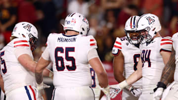 LOS ANGELES, CALIFORNIA - OCTOBER 07: Tanner McLachlan #84 of the Arizona Wildcats celebrates a touchdown with teammates during the second quarter against the USC Trojans of at United Airlines Field at the Los Angeles Memorial Coliseum on October 07, 2023 in Los Angeles, California. (Photo by Katelyn Mulcahy/Getty Images)