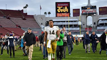 Nov 26, 2016; Los Angeles, CA, USA; Notre Dame Fighting Irish quarterback DeShone Kizer (14) leaves the field following the game against the USC Trojans at the Los Angeles Memorial Coliseum. USC won 45-27. Mandatory Credit: Matt Cashore-USA TODAY Sports