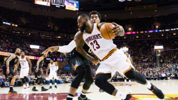 CLEVELAND, OH - JANUARY 19: LeBron James #23 of the Cleveland Cavaliers drives past Marquese Chriss #0 of the Phoenix Suns during the first half at Quicken Loans Arena on January 19, 2017 in Cleveland, Ohio. NOTE TO USER: User expressly acknowledges and agrees that, by downloading and/or using this photograph, user is consenting to the terms and conditions of the Getty Images License Agreement. Mandatory copyright notice. (Photo by Jason Miller/Getty Images)