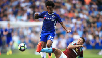 LONDON, ENGLAND - AUGUST 27: Michael Keane Eof Burnley (R) attempts a challenge on Willian of Chelsea (L) during the Premier League match between Chelsea and Burnley at Stamford Bridge on August 27, 2016 in London, England. (Photo by Ben Hoskins/Getty Images)