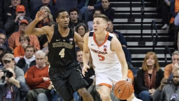 CHARLOTTESVILLE, VA - JANUARY 22: Virginia Cavaliers Guard Kyle Guy (5) dribbles the ball against Wake Forest Demon Deacons Guard Torry Johnson (4) during the second half of the Wake Forest Demon Deacons versus the Virginia Cavaliers game on January 22, 2019, at John Paul Jones Arena in Charlottesville, VA. (Photo by Gregory Fisher/Icon Sportswire via Getty Images)