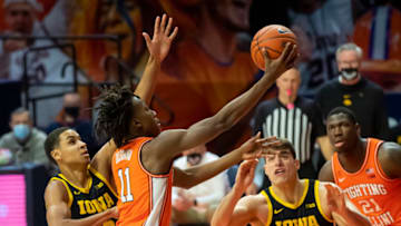 Jan 29, 2021; Champaign, Illinois, USA; Illinois Fighting Illini guard Ayo Dosunmu (11) shoots the ball against Iowa Hawkeyes forward Keegan Murray (15) and center Luka Garza (55) during the first half at the State Farm Center. Mandatory Credit: Patrick Gorski-USA TODAY Sports