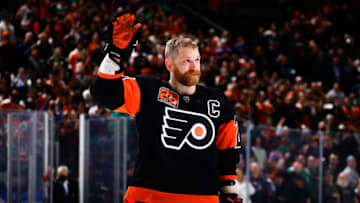 PHILADELPHIA, PENNSYLVANIA - MARCH 17: Claude Giroux #28 of the Philadelphia Flyers is honored after a win over the Nashville Predators at Wells Fargo Center on March 17, 2022 in Philadelphia, Pennsylvania. Giroux is playing in his 1,000th-career NHL game. (Photo by Tim Nwachukwu/Getty Images)