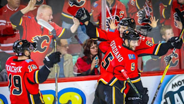 Nov 16, 2016; Calgary, Alberta, CAN; Calgary Flames right wing Michael Frolik (67) celebrates his goal with teammates against the Arizona Coyotes during the overtime period at Scotiabank Saddledome. Calgary Flames won 2-1. Mandatory Credit: Sergei Belski-USA TODAY Sports