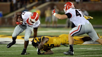 Sep 17, 2016; Columbia, MO, USA; Georgia Bulldogs running back Nick Chubb (27) carries the ball as Missouri Tigers linebacker Donavin Newsom (25) defend in the second half at Faurot Field. The Bulldogs won 28-27. Mandatory Credit: John Rieger-USA TODAY Sports