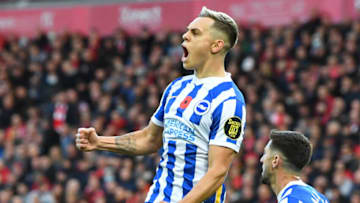 Brighton's Belgian midfielder Leandro Trossard celebrates after scoring their second goal during the English Premier League football match between Liverpool and Brighton and Hove Albion at Anfield in Liverpool, north west England on October 30, 2021. - - RESTRICTED TO EDITORIAL USE. No use with unauthorized audio, video, data, fixture lists, club/league logos or 'live' services. Online in-match use limited to 120 images. An additional 40 images may be used in extra time. No video emulation. Social media in-match use limited to 120 images. An additional 40 images may be used in extra time. No use in betting publications, games or single club/league/player publications. (Photo by Paul ELLIS / AFP) / RESTRICTED TO EDITORIAL USE. No use with unauthorized audio, video, data, fixture lists, club/league logos or 'live' services. Online in-match use limited to 120 images. An additional 40 images may be used in extra time. No video emulation. Social media in-match use limited to 120 images. An additional 40 images may be used in extra time. No use in betting publications, games or single club/league/player publications. / RESTRICTED TO EDITORIAL USE. No use with unauthorized audio, video, data, fixture lists, club/league logos or 'live' services. Online in-match use limited to 120 images. An additional 40 images may be used in extra time. No video emulation. Social media in-match use limited to 120 images. An additional 40 images may be used in extra time. No use in betting publications, games or single club/league/player publications. (Photo by PAUL ELLIS/AFP via Getty Images)