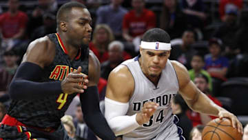 Mar 26, 2016; Auburn Hills, MI, USA; Detroit Pistons forward Tobias Harris (34) gets defended by Atlanta Hawks forward Paul Millsap (4) during the first quarter at The Palace of Auburn Hills. Mandatory Credit: Raj Mehta-USA TODAY Sports