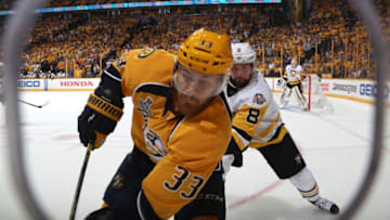 NASHVILLE, TN - JUNE 11: Colin Wilson #33 of the Nashville Predators and Brian Dumoulin #8 of the Pittsburgh Penguins skate in the corner in the first period of Game Six of the 2017 NHL Stanley Cup Final at the Bridgestone Arena on June 11, 2017 in Nashville, Tennessee. (Photo by Dave Sandford/NHLI via Getty Images)