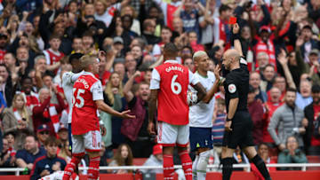 LONDON, ENGLAND - OCTOBER 01: Match referee Anthony Taylor shows a red card to Emerson Royal of Tottenham Hotspur during the Premier League match between Arsenal FC and Tottenham Hotspur at Emirates Stadium on October 01, 2022 in London, England. (Photo by Shaun Botterill/Getty Images)