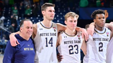 Dec 27, 2022; South Bend, Indiana, USA; Notre Dame Fighting Irish head coach Mike Brey stands with his players for the Notre Dame Alma Mater following their win over the Jacksonville Dolphins at the Purcell Pavilion. Mandatory Credit: Matt Cashore-USA TODAY Sports